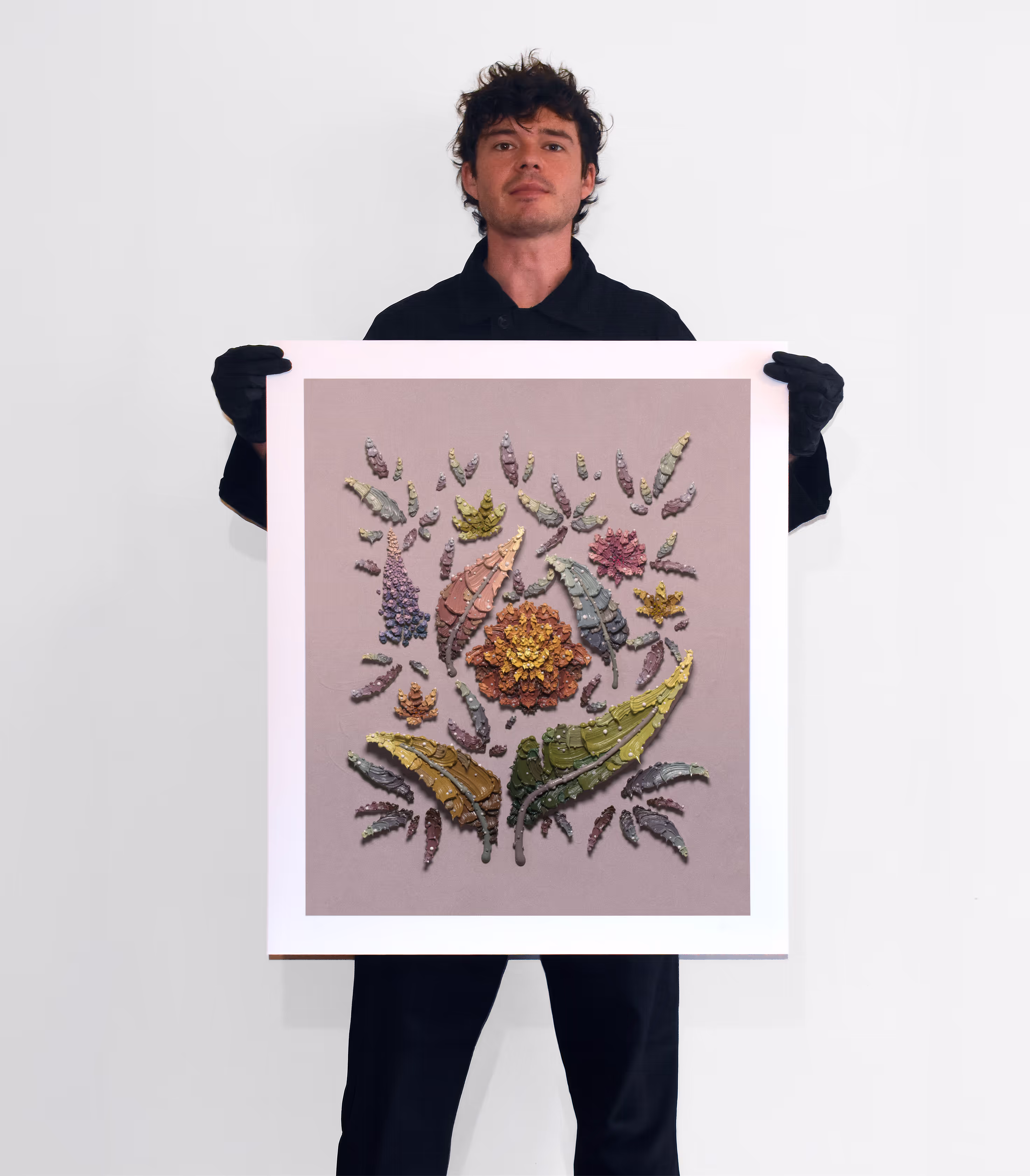 Joshua Davison holding the large Marigold Garden print